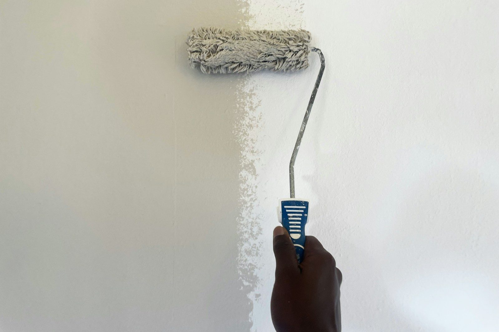 Painting a wall with a roller